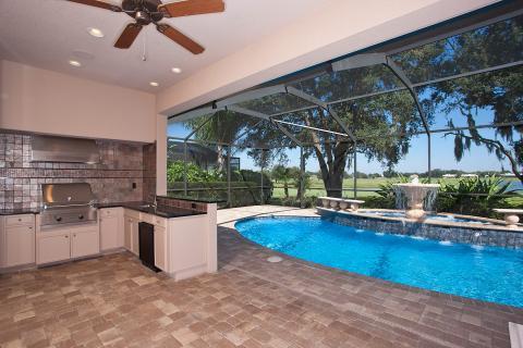 Traditional Outdoor Kitchen with stainless steel range hood