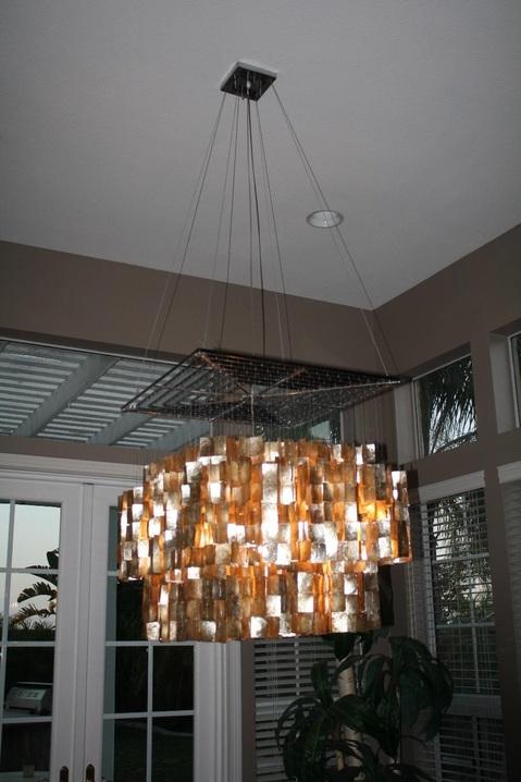 Contemporary Sunroom with amber glass chandelier