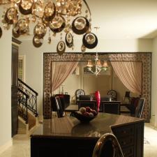 Eclectic Dining Room with wrought iron door frame detail