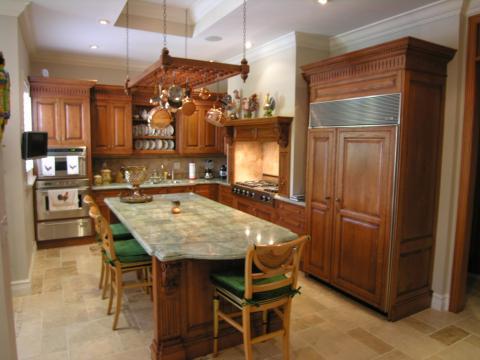 Traditional Kitchen with medium wood kitchen cabinets