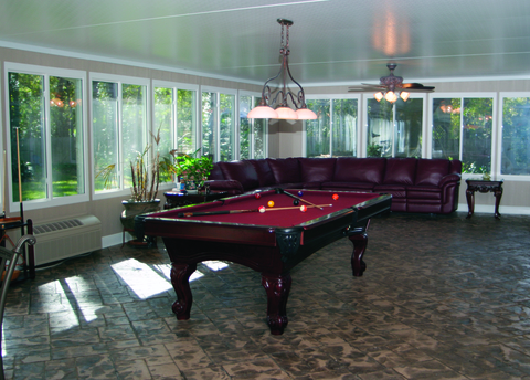Contemporary Sunroom with burgandy leather sectional sofa