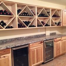 Contemporary Wine Cellar with recessed panel pine cabinet