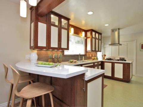 Remodeled kitchen with natural wood and frosted glass cabinets