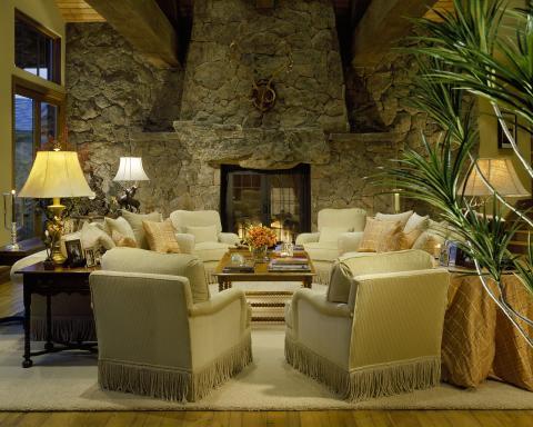 Traditional Living Room with antlers hanging above fire place
