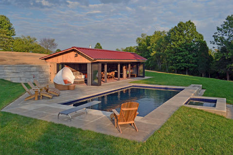Contemporary Pool with red metal seam roof