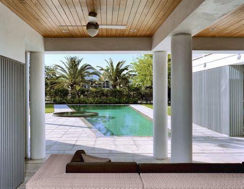 Contemporary Pool with indoor space open to outdoor patio