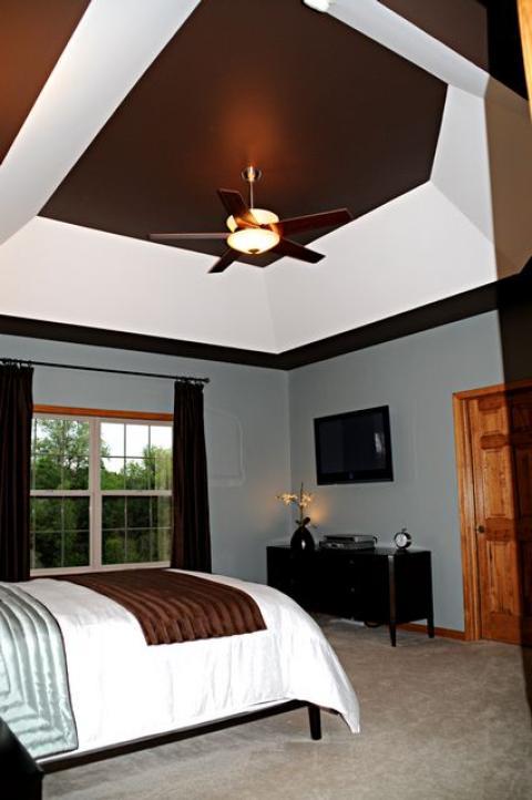 Contemporary Bedroom with brown and blue bedding