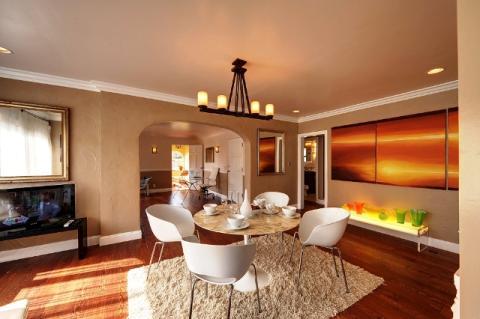 Eclectic Dining Room with large horizontal sunset painting