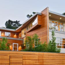 Modern Home Exterior with light wood paneling