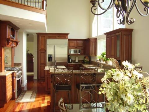 Traditional Kitchen with dark wood stained cabinets