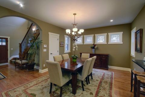 Transitional Dining Room with beige cushioned dining chairs