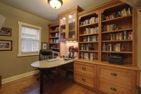 Traditional Home Office with built in cabinet book cases