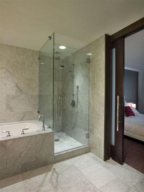 Modern Bathroom with marble tile encased jacuzzi tub