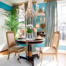 Eclectic Dining Room with gold trim black circular table