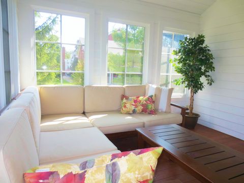 Casual / Comfortable Sunroom with painted wood plank floor
