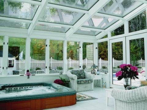 Traditional Sunroom with white wicker patio furniture