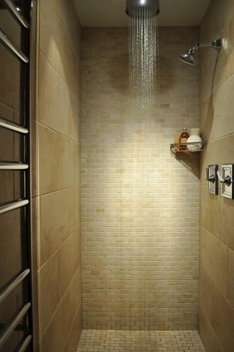 Transitional Bathroom with small light tan stone tile shower wall covering