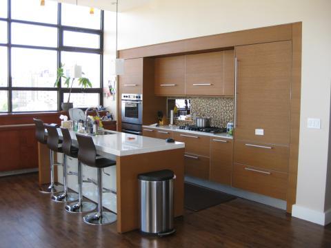 Modern Kitchen with dark brown breakfast bar stools with metal sands
