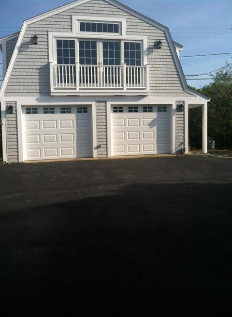 Transitional Garage with white sectional garage door
