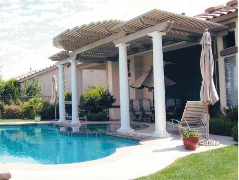 Traditional Pool with floral design outdoor furniture