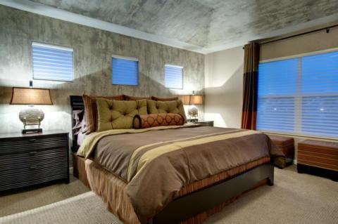 Contemporary Bedroom with small square windows on bed wall