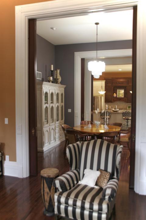 Eclectic Dining Room with wide white trim and moulding