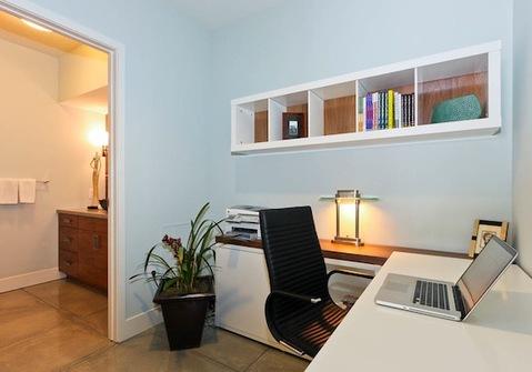 Contemporary Home Office with stained wood shelf back