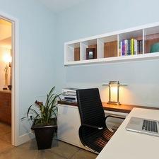 Contemporary Home Office with stained wood shelf back