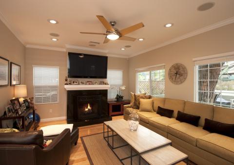 Contemporary Family Room with fire place with dark tile border