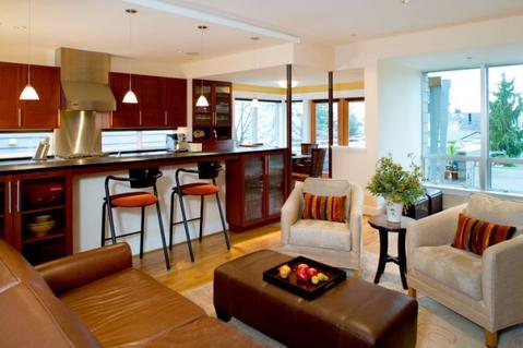 Contemporary Family Room with display glass front cabinets