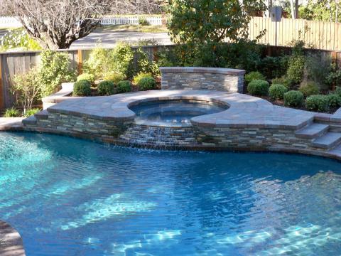 Traditional Pool with wooden privacy fence