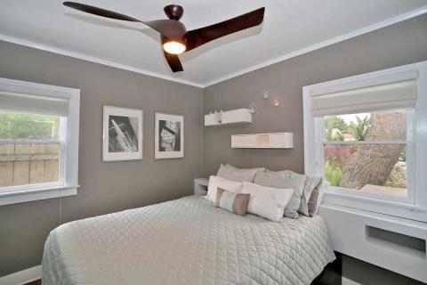 Contemporary Bedroom with dark wood modern style ceiling fan with lights