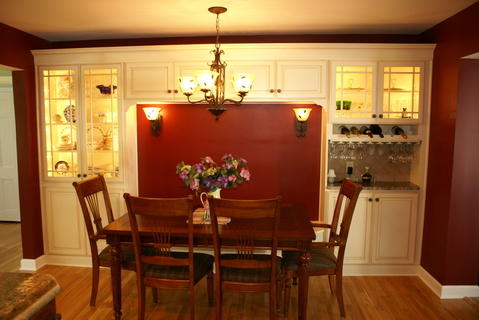 French Country Dining Room with built in wine glass storage