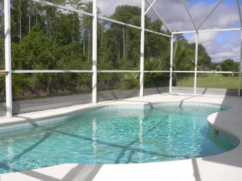 Tropical Pool with white metal support columns