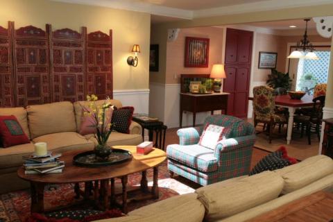 Eclectic Family Room with red room divider used for wall art