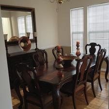 Transitional Dining Room with dark dining table and chairs