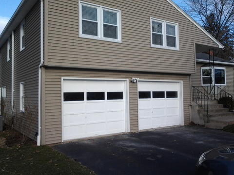 Transitional Garage with wrought iron railings