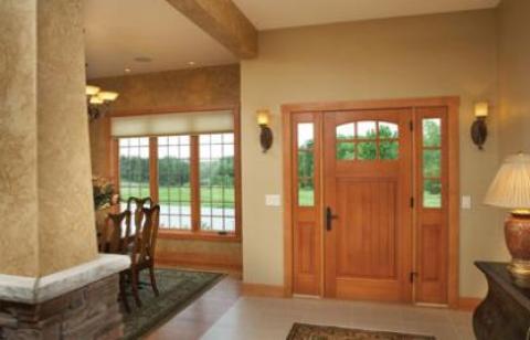 Arts & Crafts Entry with hardwood flooring in dining room