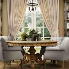 Transitional Dining Room with light gray upholstered dining chairs