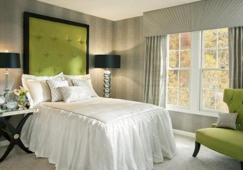 Contemporary Bedroom with bright green upholstered head board