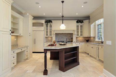 Transitional Kitchen with side by side refrigerator with cabinet paneling