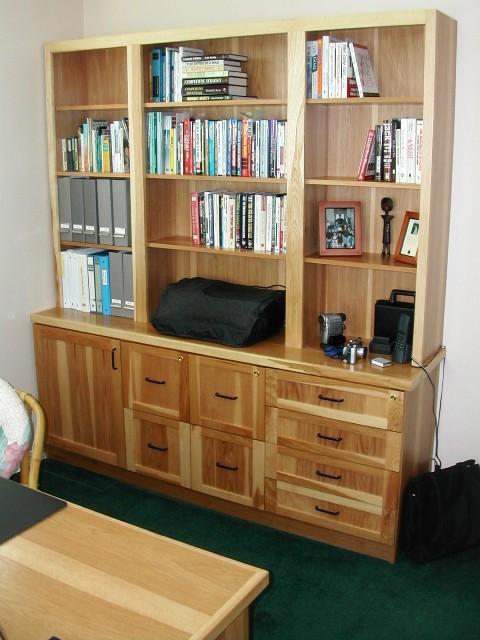 Traditional Home Office with book shelf with drawers