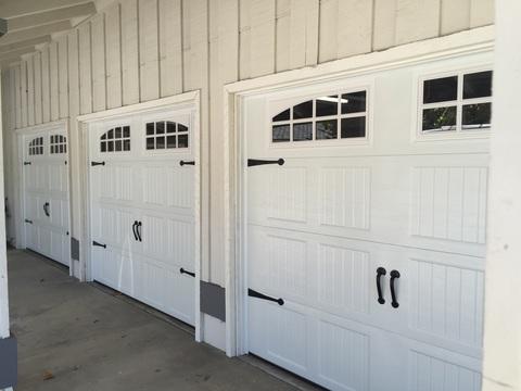 Transitional Garage with carriage style garage door