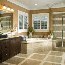 Traditional Bathroom with tan and white tile shower wall covering
