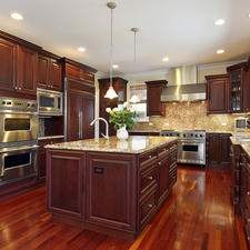 Traditional Kitchen with large island with granite countertop
