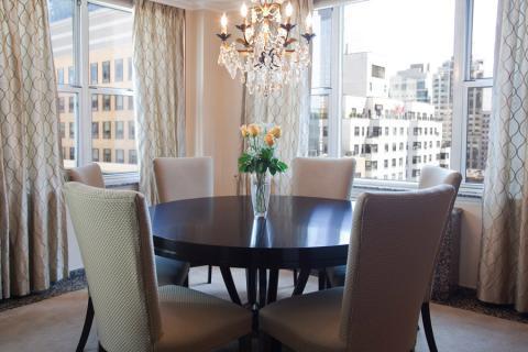Transitional Dining Room with tan upholstered high back dining chairs