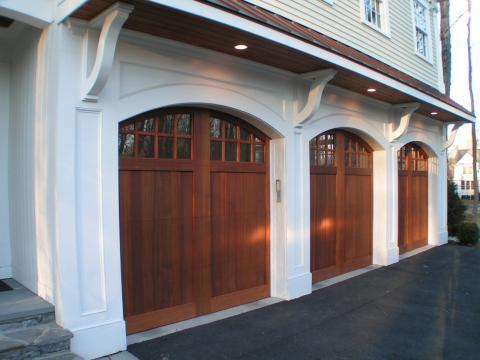 Transitional Garage with small windows on garage doors