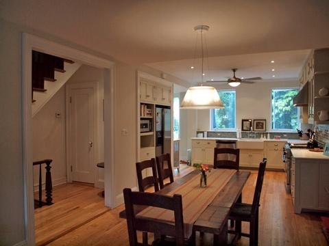Transitional Dining Room with large refinished wood dining room table