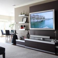 Contemporary Family Room with dark wood built-in media center