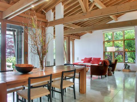 Contemporary Dining Room with light wood ceiling beams